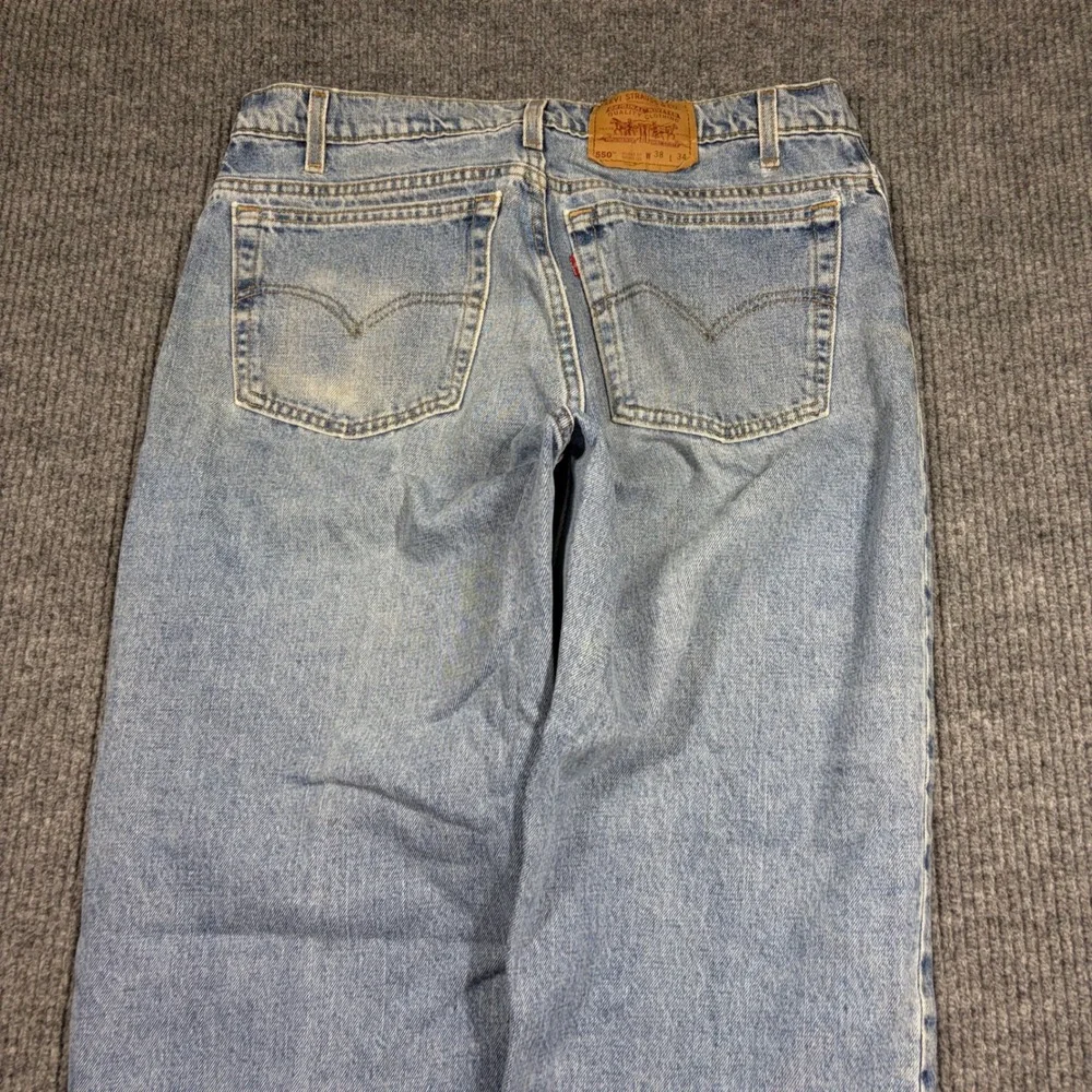 Vintage Levi's 550 Jeans Men's 38x34 Relaxed Fit Tapered Leg Light Wash 90s
